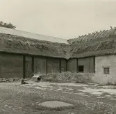 Motiv från gården Norra Runsten 3:3. nordvästra hörnet av ladugården.