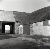 Ekonomibyggnad uppförd i sten i Arbelunda.