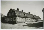 Sahlströmska huset i kvarter muren. En butiksbyggnad. Bild tagen 1908.