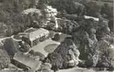 Ett vykort tryckt efter ett flygfoto över Berga säteri.