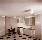 I samband med att byggandet av hyreslägenheter tog fart under 1950-talet började byggmästare Ivar Tegnander tillverka egna köksutrustningar. Verksamheten expanderade och under 1960-talet bildades AB Standardsnickerier, senare Kalmarkök, som tillverkade köksinredningar för såväl flerbostadshus som villor. Verksamheten bedrevs i kvarteret Giraffen. När den upphört övertogs lokalerna av Kooperativa Förbundet som öppnade Obs! stormarknad.