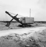 En grävmaskin vid en stenbrytningsverksamhet på Albrunna.