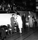 Skara. Bordtennis; Sverige - Kina 1962. Stadsfullmäktiges ordförande Eva Åsbrink hälsar kineserna t.h. BTK:s ordförande Stig Larsson.

Skara Bordtennisklubb