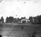 Okänt bostadshus i ett lantbruk



