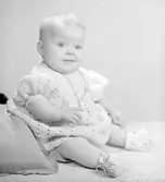 Spädbarnet, Roos Larsson, december 1946