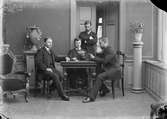 Bernhard Palmgren och tre andra män spelar kort, Uppsala 1884