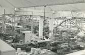 Interiör. Maskinell frakt av lådor med gods till utlasningsutrymme, Hushållsporslinsfabriken.