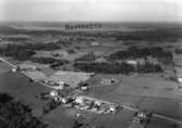 Flygfoto över Svarttorp i Anebys kommun, Jönköpings län. Nr  N  L  814.