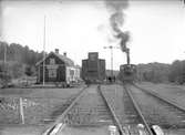 Godsvagn med bromshytt vid Gläborg station.