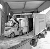 Godslastning i container.