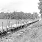 Spårrevision. Räls och slipersbyte (betongslipers). Linjen Rotebro, R - Zlpv. Uttransport av färdigt spårspann