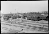 Göteborg C, Persovagnsbangården, när ombyggnaden är färdig, efter 1931.
Vagnar man ser helt från mitten och till högerkanten är Bergslagernas Järnvägars, BJ. Längst till vänster en Statens Järnvägar, SJ C05 och till höger därom vagnar från SJ och Göteborg - Borås Järnväg, GBJ. I bakgrunden Bergslagernas Järnvägs stationshus Göteborg N.
TT