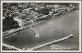 Jönköping. Flygfoto med hamnpiren, posthuset och järnvägsstationen i förgrunden.