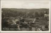 Vy över Kyrkekvarn där Tidafors Sulfitfabrik låg före branden 1918.