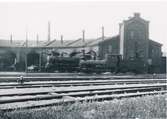 Karlskrona - Växjö Järnväg öppnades för allmän trafik 1874. Samma år färdigbyggdes stationshus i två våningar. Bangården utformades så att denna hade plats för fem spår.
Det första provisoriska lokstallet byggdes redan 1872 norr om Karlskrona station. Nytt lokstall byggdes samtidigt med bangården 1874 helt av tegel och inrymmande 6 stallplatser.