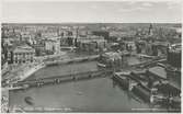 Utsikt från Stadshusets torn.Norra Järnvägsbron över Norrström mellan Riddarholmen och Stockholm Central.