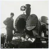 Vy vid Uppsala Östra. Stockholm Roslagen Järnväg, SRJ lok 22.