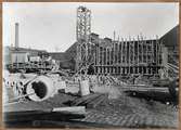 Byggnation av vägbro över bangården vid Lund centralstation. Uppförande av östra landfästet, december 1924.