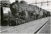 Ånglok på bangård. Ort okänd.