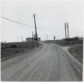 Järnvägsövergång vid Simrisvägen utanför Simrishamn, på sträckan mellan Järrestad och Simrishamn.