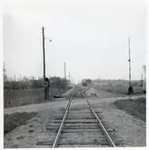 Järnvägsövergång vid Gringelstad station, på sträckan mellan Långebro och Everöd. Stationshuset skymtas till vänster i bild.