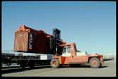 Lastning/lossning container med truck.