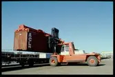 Lastning/lossning container med truck.