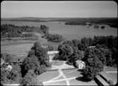 Flygfoto över Ohs Bruks Herrgård i Värnamo kommun. Nr. H. 1855.