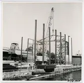 Verkstad för träfartyg, montering av takstol, östra fasaden