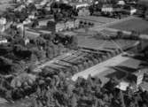 Flygfoto över Gislaveds kyrka och Johan Orreskolan i Gislaved, Jönköpings län. Nr R 1801