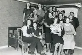 Fest ev. bygdegården 1940-1945.
Bakre raden fr. v. A-M Johansson, Inga Britt Johansson, ?, ?, Rune Pettersson, Klippan, ?.
Mellersta raden fr. v. med dragspel Karl Nilsson, Tulebo, Issi Larsson, Sporred, Nils Winkvist, Tulebo, ?, 
Eivor Dahlberg Bjerrhede, Gunhild Larsson Melin, Thure Johansson Bjerrhede, ?.
Främre raden fr. v. Sven Svensson, Vommedal, Dagmar Johansson Svensson, Vommedal, ?, Kurt Johansson Fagared, ?. 
Inga Britt och A-M Johansson tvillingar.