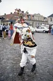 Utklädd dansare under Karnevalen. Stora torget