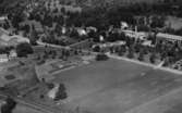 Flygfoto över Tenhult i Jönköpings kommun.  Nr: 1189/1957