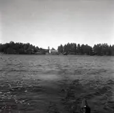 Ekonomibyggnad och sjöbod, okänd ort.