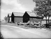 Sjöbodar och båtar vid Sjötullen, Östhammar, Uppland