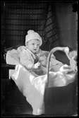 Spädbarn i barnvagn