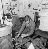 Arbetsbilder på Baltic Print i botten och maskinrum