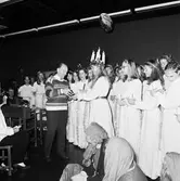 Lucia i matsalen och kontorshuset