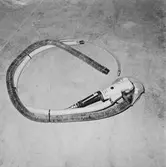 Arbetsverktyg och skyddsmasken i plastverkstan