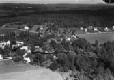 Flygfoto över Vetlanda Ullspinneri i Sjunnen, Vetlanda kommun. Nr D 2240