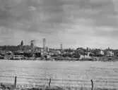 Enköping, kvarteren Beckasinen och Hägern, från hamnspåret, mot öster