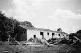 Lackarebäckshemmets personalbostäder, under uppbyggnad, längst upp mot sydost 1949-1950.