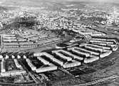 Flygbild över Åbyområdet (bebyggelsen söder om Baazgatan). I bakgrunden ses Broslätt och Mölndalsbro, 1968.