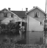 Översvämning i Mölndal, Mölndalsbro. Kungsbackavägen 1 (alldeles intill Mölndalsbro, bron över Mölndalsån).