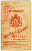 Baksida till visitkort från Bernhard Hakelier, efter 1871