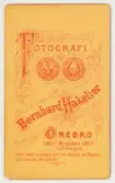 Baksida till visitkort från Bernhard Hakelier, efter 1900