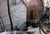 Mölndals Kvarnby i januari 1999. Mölndalsfallen med intilliggande industribyggnader.
