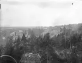 Vy från Kroppefjäll över Dals Rostock och järnvägsstationen. Bilden är tagen tidigt 1920-tal