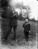 Dals Rostock. Man och pojke med pipor