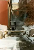 Mölndals Kvarnby vintern 1985. Mölndalsfallen med intilliggande industribyggnader.